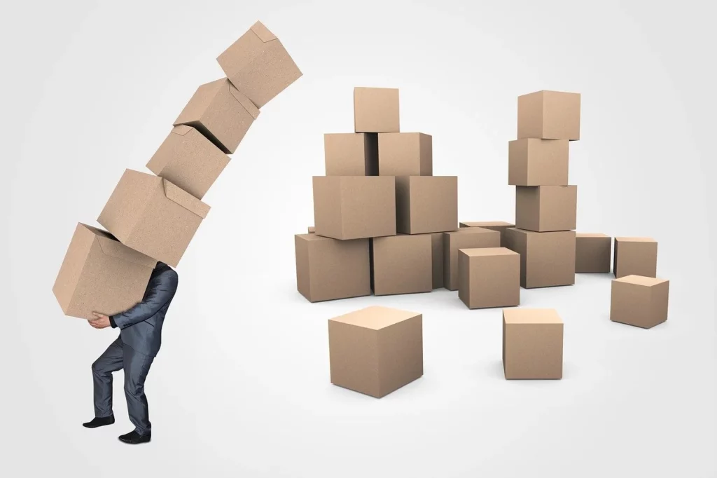 a man handling shipping boxes